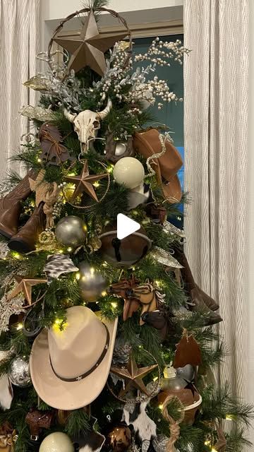 Antoinette Boston on Instagram: "Tree 47!
Who’s been to the Trinity Falls Tour of Trees? Make sure you pop in to see tree #4, Texas Yuletide! I shopped with 7 different vendors/stores to create this look. It’s such a unique tree! 

#country #texas #stockyards #horse #boots #christmas #fwstockyards #christmas2024 #trendingreels #countrymusic #countrychristmas #cozy #christmastree #thanksgiving" John Deere Themed Christmas Tree, Cowboy Hat Tree Topper, Cowhide Christmas Tree, Ranch Christmas Decor, Cowboy Christmas Decorations, Christmas Candy Table, Texas Stockyards, Cowboy Christmas Tree Ideas, Cowboy Christmas Tree