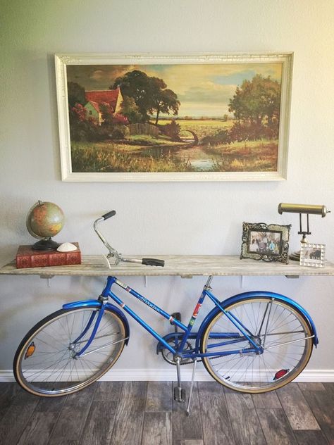 When I bought my vintage bike years ago, I knew it was extra special... But having moved and downsized, she needed to find a home where she didn't collect dust. When no one wanted to buy her, my vision of making a credenza was born! We used a rustic room divider that I no longer used. My husband was the best at recreating my vision and he installed brackets to secure the wood to the wall (I wanted it to appear as though the table was being held up by the bike) And the finished lo… Credenza Diy, Bjj Gym, Reused Furniture, Cheap Closet, Bike Decor, Bicycle Diy, Vintage Milk Can, Sweet Charity, Old Bicycle