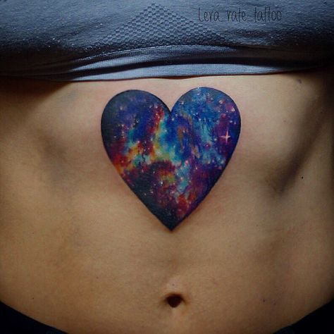 Heart-shaped cosmic scenery tattoo on the belly Tattoo On Sternum, Watercolor Heart Tattoos, Scenery Tattoo, Cosmic Heart, Galaxy Tattoo, Bff Tattoos, Space Tattoo, New School Tattoo, Watercolor Heart