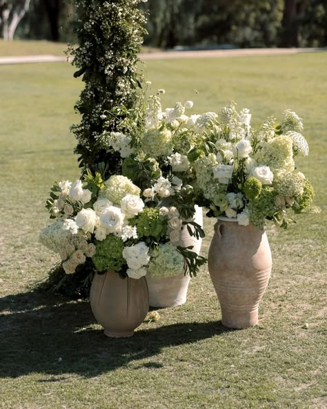 Quiet luxury meets natural beauty. We transformed Ojai Valley Inn into a serene Oasis for a timeless wedding ceremony. Simple, elegant designs highlighted the venue’s stunning surroundings, creating an unforgettable experience. @michelbevents @matthewhanlon Flowers On The Floor Wedding, Small Elegant Wedding Ceremony, Fall Garden Wedding Ceremony, Wedding Ceremony Flower Pedestal, Wedding Altar Simple, Simple Timeless Wedding Decor, Chateau Wedding Ceremony, Timeless Wedding Look, Wedding Ceremony Florals On Ground