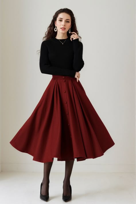 This skirt effortlessly combines style and comfort. The A-line silhouette offers a flattering fit, while the high-quality wool fabric ensures warmth and softness. The button-down detail adds a touch of sophistication to this versatile skirt, suitable for various occasions. DETAIL * 30% wool, 30% fiber, 40% polyester * fully satiny liner * Two side pockets * Right zip closure * elastic band at the back to provide some stretch * Plus size full skirt * Mid calf length * Perfect for Winter, autumn * Learn More about the items From the FAQs on the page bottom MODEL SIZE Bust 85 cm(33.4")  Waist 67 cm(26.7")  Height 168cm (5' 6") She wears size XS CUSTOM MADE SERVICE If you * Change other color * Can't find your size in our size Chart * Change the Style * Change the length * Your Height is not B Burgundy Wool Skirt, Warm Skirts For Winter, Outfits For A Wedding Guest Winter, Fall Thanksgiving Outfits For Women, Cute Skirt Winter Outfits, Full Circle Skirt Outfit, Midi Wool Skirt Outfit, Vintage Inspired Fall Outfits, Midi Skirts Ideas