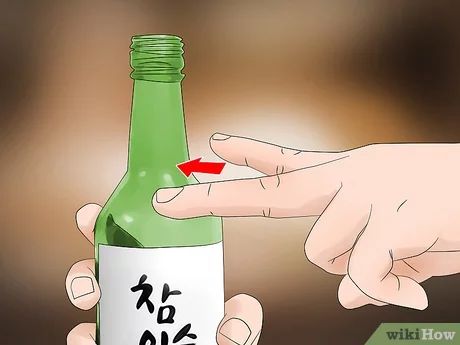 How to Drink Soju: A Guide for Beginners Korean Soju, Korean Drinks, Popular Drinks, Bottom Of The Bottle, Alcohol Content, Soju, Drinking Games, Drinking Glass, Sake