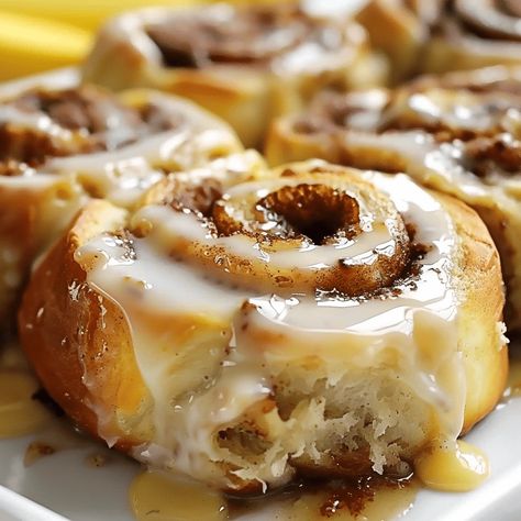 Banana Bread Cinnamon Rolls combine soft banana bread with gooey cinnamon filling. Perfect for brunch or dessert! Try them today! Recipe For Cinnamon Rolls Easy, Banana Baking Ideas, Easy Family Dessert Ideas, Nut Bread Recipes, Baking With Bananas, Banana Biscuits, Soft Banana Bread, Banana Cinnamon Rolls, Banana Bread Cinnamon Rolls