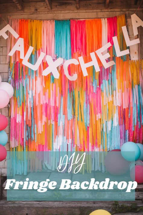 The text reads DIY Fringe Backdrop. The photo behind the text is a big backdrop made of many different colour strands. A Fauxchella banner also hangs at the top of the backdrop. Photo Backdrop Colorful, Mylar Backdrop Diy, Diy Tissue Paper Backdrop, Diy Plastic Table Cloth Photo Background, Diy Plastic Fringe Backdrop, Tassle Backdrop Photo Booths, Diy Tablecloth Garland, How To Do A Fringe Backdrop, Easy Photo Booth Backdrop