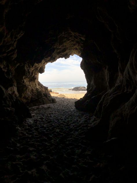 a sea cave in malibu california Beach Cave Aesthetic, Slayology Hair, Sea Cave Aesthetic, Stuck On A Deserted Island Aesthetic, Honeysuckle Aesthetic, Deserted Island Aesthetic, Pirate Aesthetics, Cave Aesthetic, Rock Guys