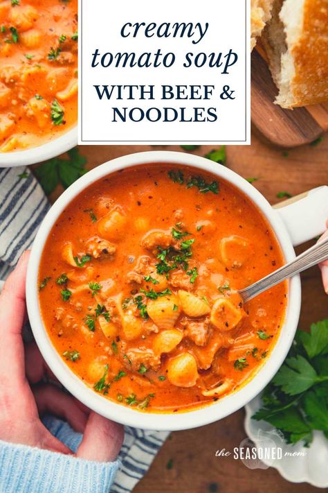 Creamy tomato soup with ground beef and noodles is an easy one-pot dinner that's ready in less than 45 minutes! Add a loaf of crusty bread or a simple green side salad for a delicious and family-friendly weeknight meal. Soup Recipes With Ground Beef And Pasta, Creamy Beef Tomato Soup, Creamy Beef And Tomato Noodle Soup, Beefy Tomato Soup, Beef Orzo Soup, One Pot Beef And Tomato Macaroni Soup, Soups With Ground Beef, Beefy Macaroni Tomato Soup, Ground Beef Soup Recipes