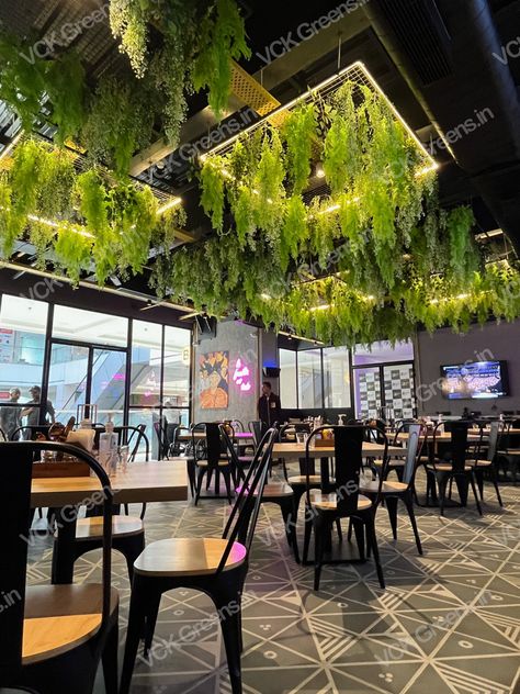 Your coffee shop doesn’t have to look like a coffee shop. It could be a lively, vibrant space that’s inviting and warm. Add artificial plants 🌱 and you can recreate this feeling indoors! Indoor Cafe Design, Coffee Shop Ceiling Design, Coffee Shop Plants, Restaurant Design Inspiration, Modern Restaurant Design, Outdoor Restaurant Design, Coffee Shop Interior Design, Coffee Shops Interior, Modern Restaurant