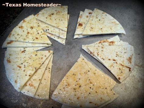 Oiled and seasoned tortillas cut into triangles to bake for homemade pita chips. Chips From Tortillas, Recipes Using Flour Tortillas, Recipes Using Flour, Flour Tortilla Chips, Baked Pita Chips, Homemade Pita Chips, Tortilla Bake, Spicy Hummus, Easy Hummus Recipe