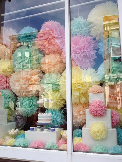 pom-pom window display // chicago Window Display Background, Birthday Window Display, Art Gallery Window Display Ideas, Grand Opening Window Display, Sweet Window Display, Easter Shop Window Displays, Pastel Window Display, Bakery Window Display, Anthro Window Display