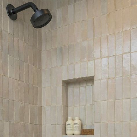 The Beverly Casa on Instagram: "An alternative to the ubiquity of subway tiles; this vertical stack of creamy white Zellige feels fresh & clean without being boring in a guest bathroom. The color of the tile is intentionally varied so pairing with monochromatic grout eliminates visual clutter, we didn’t want grout lines distracting from the handmade nature of the Moroccan tiles. We love using local vendors, this tile is from Dallas based @riadtile 🚿 ⁣ .⁣ .⁣ .⁣ .⁣ .⁣ #moroccantile #riadtile #tiledesign #bathroommakeover #lightandbright #zelligetiles #zelligeiltes #bathroom #tile #tileshower #tileinstallation #tiles #interiordesign #bathroomdesign #zellige #tilework #design #zelligetile" Bathroom Without Tiles, Zellige Tile Bathroom, Tile Edge Trim, Visual Clutter, Airbnb House, Tile Edge, Zellige Tile, Moroccan Tiles, Subway Tiles