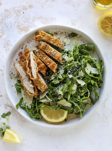 Crispy baked parmesan chicken is super easy to make and so delicious! Served with a simple arugula salad - you will crave this dinner! Baked Parmesan Chicken with Lemon Arugula - Crispy Baked Chicken #bakedparmesan #chicken #salad Baked Parmesan Chicken, Chicken Strip Recipes, Oven Baked Chicken Parmesan, Chicken With Lemon, Crispy Baked Chicken, Healthy Weeknight Meals, Baked Chicken Parmesan, Parmesan Crusted Chicken, Parmesan Chicken