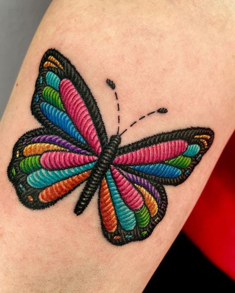 30 Embroidery Tattoos That Show Off This Emerging Trend | Have you seen these cool embroidery tattoos yet? Lifestyle Butterfly Embroidery Tattoo, Cool New Tattoo Ideas, Stitch Work Tattoo, Embroided Tattoos, Tattoo That Looks Like Embroidery, Small Embroidery Tattoo Ideas, Mexican Embroidery Tattoo Ideas, Pach Tattoo Ideas, Uv Ink Tattoos For Women