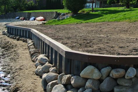 Contractor building a steel seawall bulkhead for lake property Lake Seawall Ideas, Seawall Landscaping, Creek Retaining Wall, Waterfront Retaining Wall Ideas, Lake Bulkhead Ideas, Lake House Retaining Wall, Seawall Ideas Lake Retaining Walls, Gravity Retaining Wall, Steel Retaining Wall