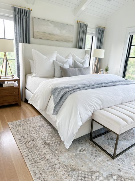 Neutral Coastal Master Bed, Simple Classy Room Ideas, Coastal Modern Bedding, White King Bedding Ideas, White Master Bedding Ideas, Blue White Grey Room Master Bedrooms, Guest Room Organic Modern, Curtains For Master Bed, Neutrals And Blue Bedroom