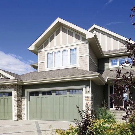 With a beautiful sage green tone, these steel garage doors are a stand-out home feature. | Instagram Green Garage Doors, Green Garage Door, Contemporary Garage Doors, Color Projects, Green Garage, Carriage House Doors, Sectional Garage Doors, House Colour, Garage Door Types