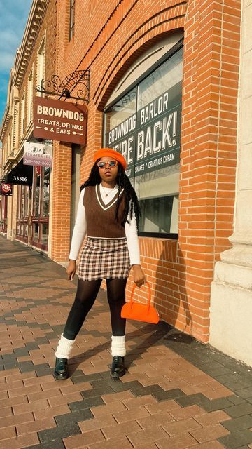 Chandra| Fashion & Lifestyle UGC Creator on Instagram: "Mocha mocha babes Orange beret : @sheinofficial White turtleneck: @hm Brown vest: @hm Brown mini skirt: @shein_us Black tights: @target Black loafers: @dsw Orange bag: @hm • • • • • • • Street style, street wear style, fashion style, outfit inspo, outfit inspiration, winter outfit, brunch outfit, aesthetic style , preppy fits #sweatervests #berets #miniskirt #orangeoutfits #legwarmers #dailyfashion #ootdstyle #mystyle #colorblock Women Hats Fashion Winter, Orange Beret Outfit, Black Beret Outfit Winter, Brown Beret Outfit, Beret Outfit Fall, Outfits With Beret Hats, Orange Turtleneck Outfit, Brown And Orange Outfit, Orange And Brown Outfit