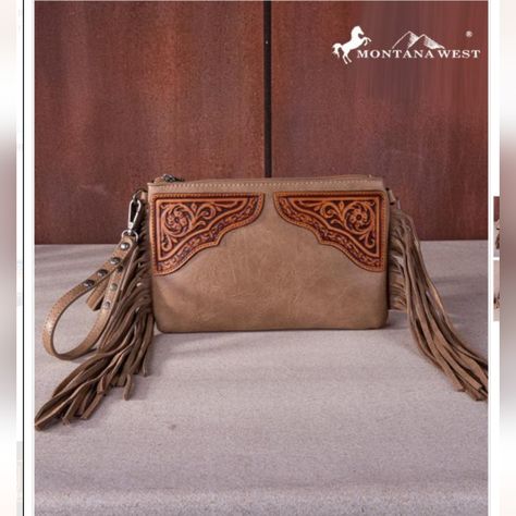 Introducing The Montana West Floral Tooled Fringe Wristlet Clutch/Crossbody Bag - Your New Go-To Accessory For Any Occasion! This Stylish Bag Measures 9.5 X 0.25" X 6.25" And Features Beautiful Floral Tooling And Trendy Fringe Details That Will Make You Stand Out From The Crowd. The Top Zipper Closure Ensures All Your Belongings Stay Secure, While The Inside Clutch Offers A Zippered Pocket And 3 Credit Card Slots For Organization On-The-Go. Need Some Extra Storage? There's An Additional Zipper P Trendy Fringe, Skull Wallet, Rodeo Fashion, Handbag Patterns, Floral Elements, Wristlet Clutch, Crossbody Clutch, Decorative Design, Stylish Bag