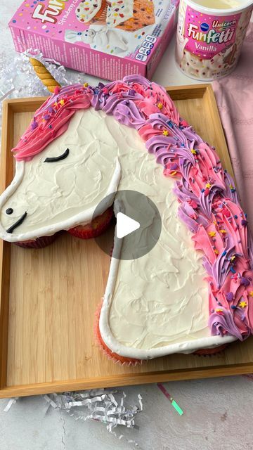 Pillsbury Baking on Instagram: "This Funfetti Unicorn Cupcake Pull Apart Cake is magically EASY to make! Uni-can do it!🦄⁠ ⁠ Be sure to save the full recipe below!📩⁠ ⁠ You’ll need...⁠ 1 box Funfetti Strawberry Cake & Cupcake Mix⁠ Additional ingredients to prepare cake mix per box directions⁠ 2 tubs Funfetti Unicorn Vanilla Frosting ⁠ 4 piping bags⁠ Piping tips( two size 1M, one size 6, one 10)⁠ Black, pink and purple food color ⁠ Gold fondant⁠ ⁠ Directions:⁠ 1. Preheat oven to 350°F. Prepare cake mix following the package directions. You will need at least 13 cupcakes. ⁠ ⁠ 2. Let cupcakes cool and arrange in the shape of the unicorn head. With a piping tip remove center of cupcakes, set aside removed cake to replace after filling each cupcake with sprinkles. Re-Cover with the cake pieces. Pull Apart Unicorn Cupcake Cake Template, Unicorn Cake How To, Unicorn Birthday Cake And Cupcakes, Strawberry Unicorn Cake, Unicorn Pull Apart Cupcakes Template, Unicorn Pull Apart Cake, Unicorn Cupcake Cake Template, Unicorn Shape Cake, Unicorn Sprinkle Cake