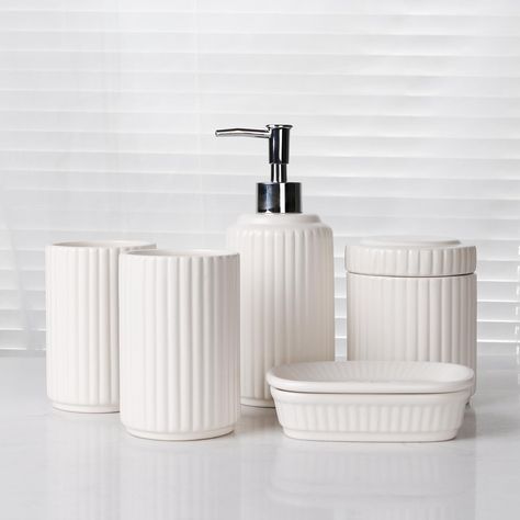 PRICES MAY VARY. Ceramic 【Classic Design】Simple, sleek, classic design to blend in with various décor. The bathroom accessories set in cream white color won't clash with most color schemes. This ceramic white bathroom accessories set is a nice beautiful addition in your bathroom kitchen sink. 【Complete Bathroom Accessories Set】This is a complete bathroom accessory set that includes: 1pcs soap dispenser, 2pcs tumbler, 1pcs soap dish，1pcs canister. Providing everything you need to keep your bathro Bathroom Interior Design Luxury Modern, White Bathroom Accessories Set, Ceramic Bathroom Accessories, Bathroom Interior Design Luxury, White Bathroom Accessories, Apartment Modern, Bathroom Accessories Set, Ceramic Bathroom, Bathroom Accessories Sets