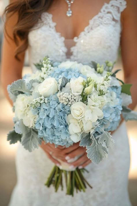 Looking for floral inspiration for your wedding? Hydrangeas bouquets with white, blue, pink, and green flowers offer endless possibilities. These ideas cater to any style, from rustic to elegant, providing a versatile and stunning option for your wedding flowers. Embrace the lush beauty of hydrangeas to add a refreshing and vibrant element to your wedding decor. Bouquet With Blue Hydrangea, Rustic Blue And White Wedding, White And Blue Hoco Bouquet, Wedding Theme Blue And White, Wedding Blue Bouquet, Hydrangea And Carnation Bouquet, White Roses And Blue Hydrangeas, Blue White Green Wedding Flowers, Light Blue Hydrangea Bouquet