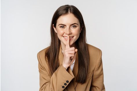 Close up portrait of female entrepreneur smiling, shushing, making shh hush sign, press finger to lips, tell secret, standing over white background. Shush Pose, Shushing Pose, Close Up Portrait, Close Up Portraits, Female Entrepreneur, Hush Hush, Close Up, White Background, Lips