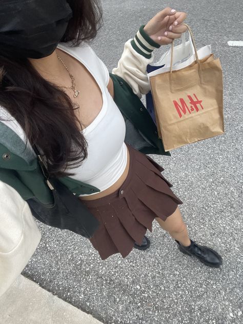 Varsity Skirt Outfit, Brown Pleated Skirt Outfit Summer, Varsity Jacket With Skirt, Brown Skirt Aesthetic, Short Brown Skirt Outfit, Brown Skirt Outfit Aesthetic, Varsity Jacket Outfit Aesthetic, Brown Tennis Skirt Outfit, Pleated Skirt Outfit Aesthetic