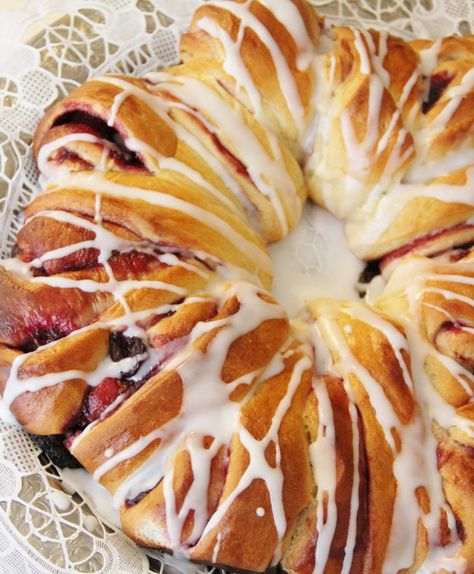 Swedish Tea Ring with Cardamon and Cherries-The Seasoned Traveler (Swiss Pastry) Swedish Tea Ring Recipe, Norwegian Dishes, Swedish Smorgasbord, Tea Ring Recipe, Swedish Tea Ring, Cardamom Recipes, Scandinavian Baking, Swedish Bread, Cardamon Recipes