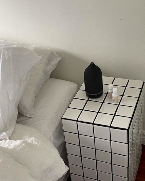 Bedside tile table with black diffuser and essential oils Tiled Bedside Table, Tile Bedside Table, Minimal Home Aesthetic, Bedroom Decor Black And White, Library Shoot, Bedroom Decor Black, Stone Diffuser, Tile Table, Decor Black And White