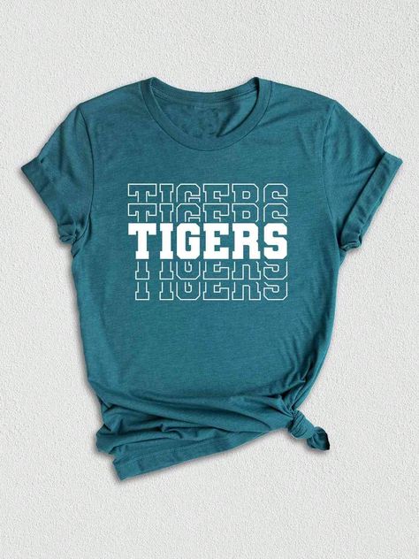 Introducing our Tigers Mascot Shirt, the perfect apparel for all the Tiger fans out there!  Whether you're a proud member of the Tigers team, a dedicated fan, or simply want to show your support, this shirt is a must-have addition to your collection. Designed with the iconic Tigers Mascot, this shirt captures the spirit and energy of your beloved team. Made with high-quality materials, this Tigers School Shirt is not only comfortable but durable as well. You'll love the softness of the fabric against your skin, making it ideal for everyday wear or game days.  In addition to being a stylish fashion statement, this Tigers Fan Shirt also makes for a great gift. Surprise your friends, family, or fellow Tigers enthusiasts with this unique and trendy graphic tee. Perfect for birthdays, holidays, Elementary Spirit Wear, Cute School Spirit Shirts, School Spirit Wear Ideas, Elementary School Tshirt Designs, College Tshirt Designs, School Graphic Tees, Tshirt Design Ideas Trendy, School Tshirt Designs, Spirit Wear Designs