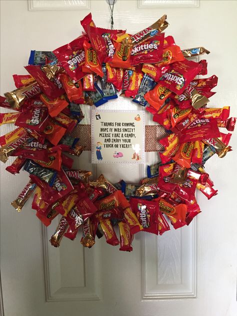 I made this for Halloween wreath for Taylor's dorm room door. Let's see how long it lasts or does someone just take the whole thing.lol it's the thought that counts, right? Super easy styrofoam wreath and a glue gun. Several bags of candy. I Really liked the starburst because they had extra wrapper you could glue and stick in small holes. College Door Wreath, Halloween Dorm Room, Room Door Decor, Halloween Dorm, Collage Dorm Room, Collage Dorm, Dorm Room Doors, Dorm Door, Candy Wreath