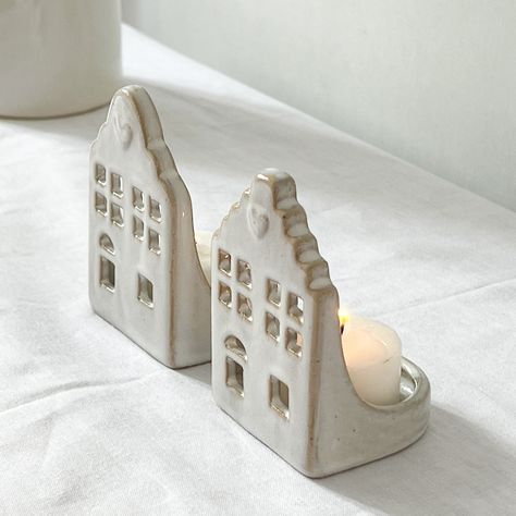 Make any room in your home glow with warmth and ambiance with this adorable Ceramic House Tealight Holder.  It makes a perfect addition to your home decor or a thoughtful gift for any occasion. Diy Clay House Candle Holders, Clay House Tea Light Holder, House Tealight Holder, Fast Ceramic Projects, Ceramic Pottery Gifts, House Pottery Ideas, Ceramic Tea Light Holders Handmade, Clay House Candle Holder, Ceramic Tealight Houses