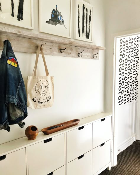 This Canadian Couple’s Toronto Home Is Filled With Vibrant Art and Old Records Narrow Hall Mudroom, Ikea Shoe Storage Mudroom, Ikea Shoe And Coat Storage Hack, Ikea Hallway Storage, Awkward Entryway Ideas, Vstupná Hala, Interior Design Living Room Modern, Toronto Home, Drawing Room Decor