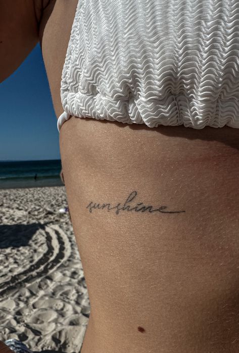 Word Sunshine Tattoo, Easy Does It Tattoo, Pocket Full Of Sunshine Tattoo, Beach Quotes Tattoo, I Am The Sun Tattoo, Sunshine Cursive Tattoo, Tattoo Ideas Sunshine, Sun Quotes Tattoo, Tattoo Area Ideas