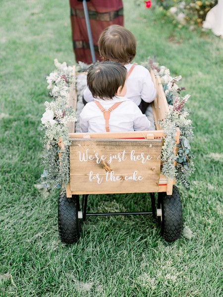 Wedding | Ring Bearer | Wedding Party | Wagon | Cute | Adorable | Ring Bearers | Ceremony | I Do | Bride | Groom | Florals | Couple | We're Just Here For The Cake | Newlyweds | Cute Couple | Couple Goals | Photography | Venue | Rustic | Outdoor | Reception | She said Yes | Neutrals | Greenery | Romantic | Petals | Dress | Guests | Ring Bearer Wagon, Wedding Wagon, Wedding Rings Couple, Petals Dress, Wagon For Wedding, Goals Photography, Wedding Planner Business Card, Ideas Wedding Party, Wedding Budget Planner