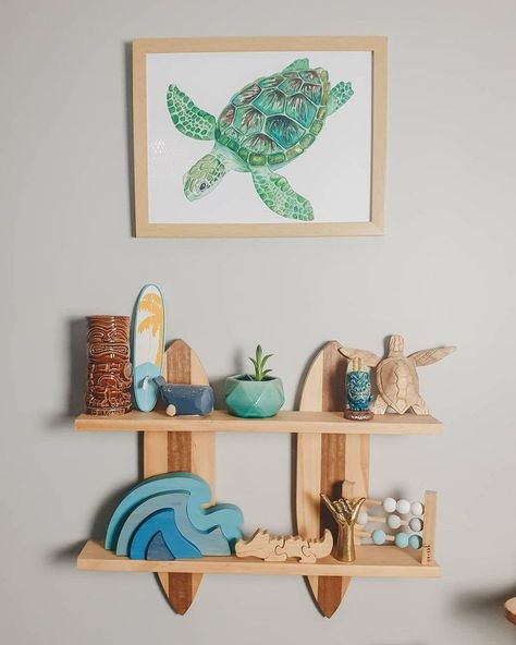 Ocean baby nursery decor with turtle painting, surf board and wooden waves Baby Boy Surfer Nursery, Boy Beach Nursery, Ocean Nursery Ideas, Ocean Baby Nursery, Seaside Nursery, Boho Beach Nursery, Beach Baby Nursery, Melody Room, Ocean Baby Rooms