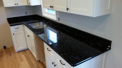 Here we have a kitchen done in Volga Blue! It's hard to tell in these pictures but when the light hits this stone just right you can see flecks of blue throughout it. This is one you have to see in person to fully appreciate! We also have many colors that we cannot publish: Call now! (423) 390-0421 or visit us: http://mountainempirestoneworks. Volga Blue Granite Kitchen, Blue Granite Kitchen, Volga Blue Granite, Natural Stone Countertops, Blue Granite, Double Wall Oven, It's Hard, A Kitchen, The Light