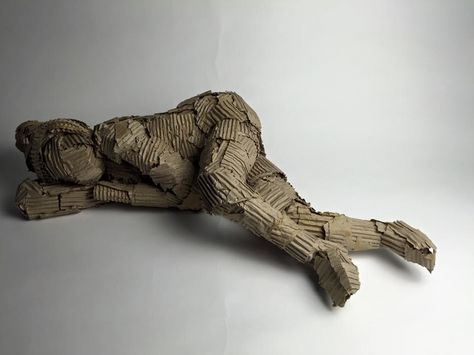 movement - cardboard sculpture, emphasising on how our thoughts and feelings are shown through our body expression and body language. This piece is showing a vulnerable pose to indicate the persons life in this case you could infer this person is homeless due to the positioning and it is also ironic that homeless sleep on cardboard just as it is the material I used. Inspired by Antony Gormley Cardboard Body Sculpture, Homelessness Art, Sleep Sculpture, Human Environment, Feeling Invisible, Human Sculpture, Antony Gormley, Art Concepts, Cardboard Sculpture