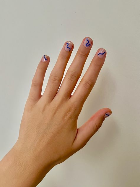 Hand with nude nail polish and cobalt blue line nail art Simple Nail Designs For Guys, Mens Nail Polish Ideas, Simple Male Nail Art, Blue Nails Men, Blue Lines Nails, Men Painted Nails Aesthetic, Blue Line Nail Art, Blue Line Nails, Masculine Nail Designs