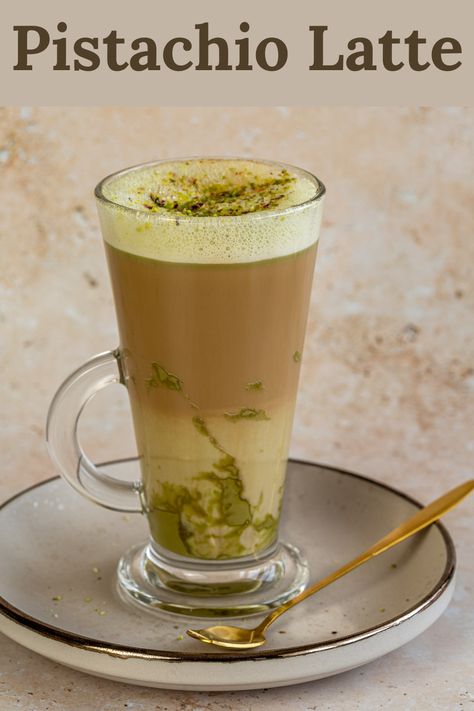 This wonderfully creamy Pistachio Latte is made with steamed milk, pistachio cream and a shot of espresso. It has the cozy flavors of sweet pistachio and is perfect for those who are a fan of the Starbucks pistachio latte. Starbucks Pistachio Latte, Pistachio Coffee, Pistachio Latte, Coconut Milk Drink, Mixology Recipes, Pistachio Milk, Steamed Milk, Shot Of Espresso, Pistachio Butter