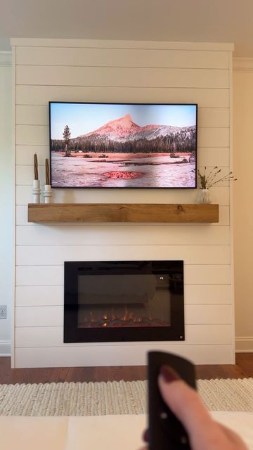 Carson Price Korenman on Instagram: "My husband came up with the idea to build a bump-out fireplace to elevate our master bedroom space… and I’m so proud of him for executing it perfectly 😍 we can’t wait to relax here as the weather gets cooler. While contractors have quoted a job like this at $3000-4000+, we spent around $1250 doing the work ourselves (this includes wood, shiplap, paint supplies, electric fireplace, mantle, and recessed TV mount - we used a frame TV we already own). The exact products we purchased are linked in my Amazon storefront (link in bio), or comment “LINKS” to get the info sent directly to you. 

Design plan inspired by @anawhiteplans 
.
.
.
#marriagegoals #diyhomedecor #diyfireplace #cozyseason #masterbedroomdesign #loweshomeimprovement #bedroomrenovation" Building An Electric Fireplace, Shiplap Mantle, Shiplap Electric Fireplace, Recessed Tv, Diy Shiplap Fireplace, Wood Mantle Fireplace, Wood Shiplap, Electric Fireplace Mantle, Houston Houses