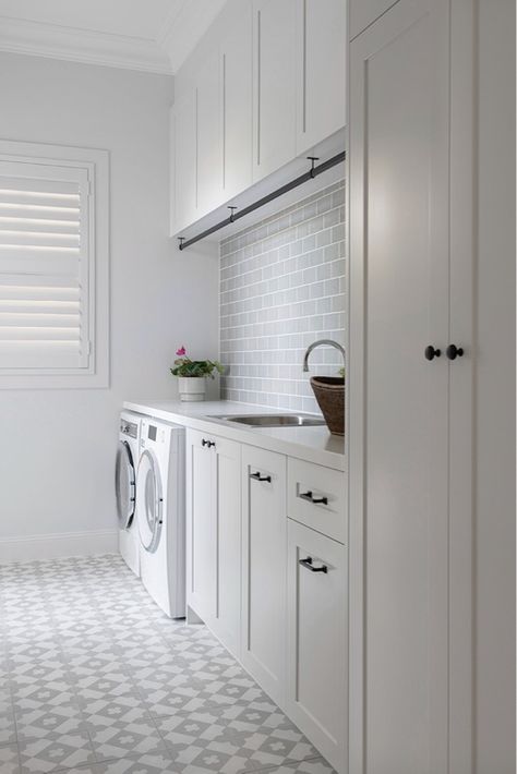 Classic Laundry with encaustic floor tiles and white shaker cabinetry. Laundry Shaker Cabinets, Shaker Laundry, Laundry Room Tiles, Laundry Room Organization Diy, Utility Room Storage, Laundry Room Tile, Laundry Room Lighting, Pantry Laundry Room, Laundry Room Flooring