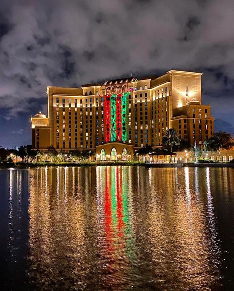 TXDisney on Instagram: “Coronado Springs’ Grand Destino tower is sneaking into one of my top 5 WDW Resorts for Christmas!!! 🏰🐭🎁💙🎅🏻🎄❤️❄️🌌❤️❄️🎄🎅🏻💙🎁🐭🏰 📷: @tradzak…” Coronado Springs Resort, Coronado Springs, Spring Resort, Disney Christmas, Opera House, Sydney Opera House, Springs, Tower, Building