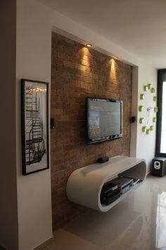 slightly inset stone or brick wall section for tv (more traditional media console beneath) Living Room With Brick Wall, Tv Kastenwanden, Lcd Wall, Simple Living Room Designs, Ruang Tv, Wall Mounted Tv Cabinet, Tv Mounted, Tv Fal, Theater Rooms