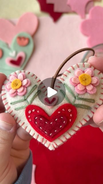 Brianna on Instagram: "Folksy felt ornaments: Valentine’s edition! Coming soon. 💘 I’ll have 3 heart and 3 flower ornaments available along with the patterns. (And just like the snowflake patterns, instructions will not be included.) . . . #modernembroidery #fiberart #embroideryart #handstitched #stitchersofinstagram #dmcembroidery #michiganartist #bordados #embroiderypattern #feltart #valentines #heart" Felt Hearts Diy, Valentine Felt Ornaments, Felt Heart Ornaments, Felt Heart Keychain, Felt Hearts Crafts, Felt Valentine, Felt Hearts Valentine Embroidery, Pink Felt Hearts, Snowflake Patterns