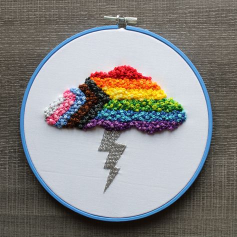 Pride flag cloud with lightning bolt. Cotton floss over cotton fabric in hand painted bamboo hoop 🌈🌩️⚡ Pride Flag Embroidery, Pride Embroidery Ideas, Embroidery Upcycling, Cloud With Lightning, Pride Crafts, Pride Decorations, Pride Embroidery, Textiles Ideas, Jumper Embroidery