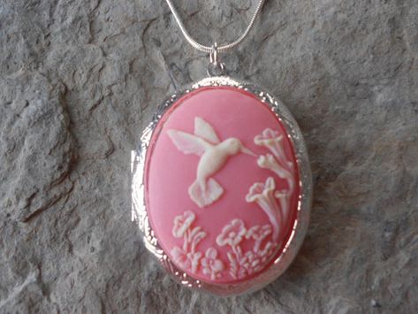 For sale are perfectly detailed, flawless (cream colored hummingbird on a perfect pink background) cameo pendant LOCKETS!!!! Gorgeous!!! About 1 3/4" long, silver plated with victorian scroll, it can hold 2 photos or a keepsake!!! They are offered at a reasonable price, make perfect gifts, and are wonderful quality!!!! and the chain is 22" .925 silver plated 1.2mm snake chain, with a lobster claw clasp!!!!  I make several varieties, colors, styles and matching sets!!!!  I will be glad to do spec Pink Pendant, Pendant Locket, Cameo Jewelry, Cameo Pendant, Funky Jewelry, Jewelry Lookbook, Perfect Pink, Coin Necklace, Dream Jewelry