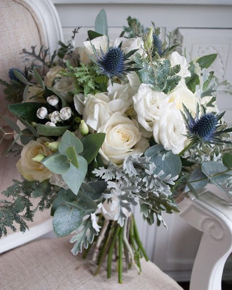 @laurelweddings on Instagram: “Love this winter wedding bouquet design filled with roses, bouvardia, eryngium and wintery foliage #winterwedding #weddingflowers…” February Wedding Flowers, Christmas Wedding Themes, Holly Wedding, White Winter Wedding, February Wedding, Winter Wedding Bouquet, Blue Wedding Bouquet, Winter Bouquet, Winter Wedding Flowers