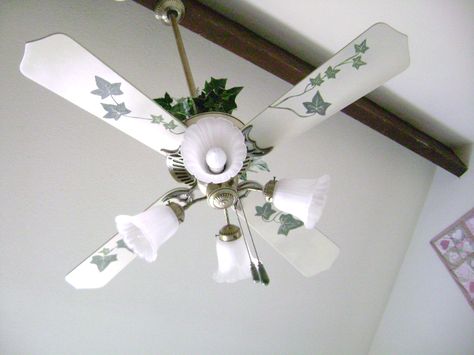 Change your ugly ceiling fan. Paint it and drape some greenery around it. Decorate Ceiling Fan, Ceiling Fan Painting Ideas, Fan Painting Ideas, Witchy Cabin, Ceiling Fan Diy, Fan Painting, Painting Ceiling, Fan Diy, Ceiling Fan Makeover