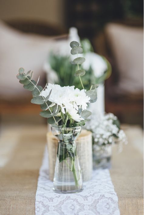 Simple rustic arrangement of chrysanthemums and eucalyptus in glass vases and bottles on a burlap and lace runner. Love this Relaxed Rustic Johannesburg Wedding - Yeah Yeah Photography Diy Keramik, Rustic Arrangements, Rustic Wedding Decorations, Boda Diy, Minimalist Wedding Decor, Unique Wedding Flowers, Wedding Floral Centerpieces, Rustic Centerpieces, Rustic Wedding Centerpieces