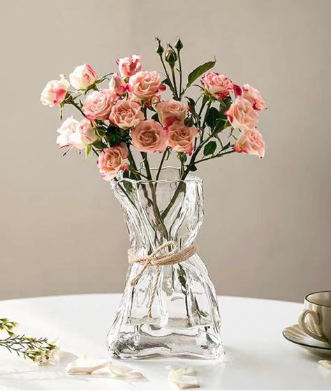 This glass flower vase captures people's attention with its unique and creative design. Decorative vase perfectly matched with natural woven grass rope, injecting new inspiration and style, creating a Unique artwork. Perfect for weddings, bridal showers, gifts, parties, housewarming gifts, and any occasion. 

#decor #vase #flowers #homedecor #interiordesign #bouquet #weddingdesign #bridaldesign #weddinggifts #spring #summer #giftsforher #romanticgift #cheapgiftideas #giftideas #table Glass Flower Vase, Centerpiece Table, Glass Flower Vases, Vase Shapes, Vase Centerpieces, Big Flowers, Vases And Vessels, Holiday Decor Christmas, Unique Artwork